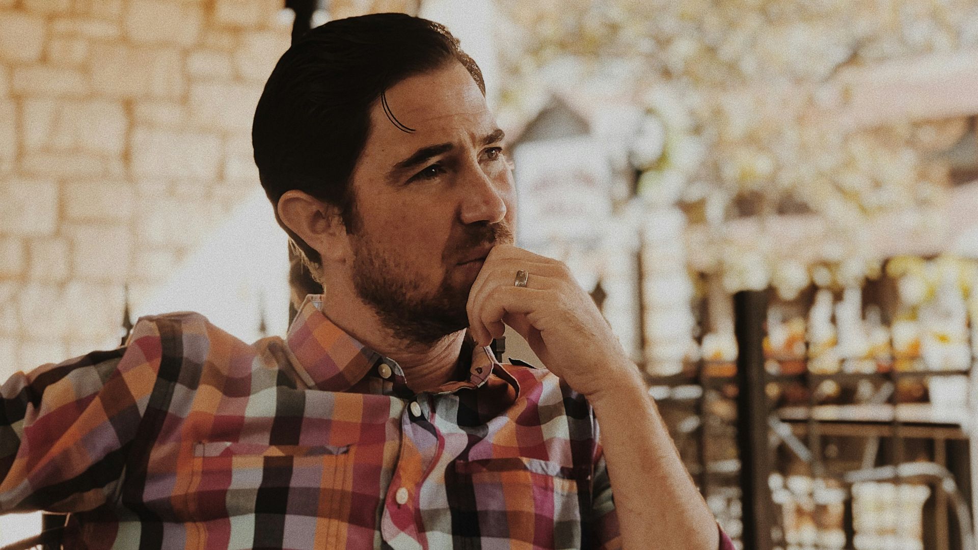 man in red and black plaid dress shirt