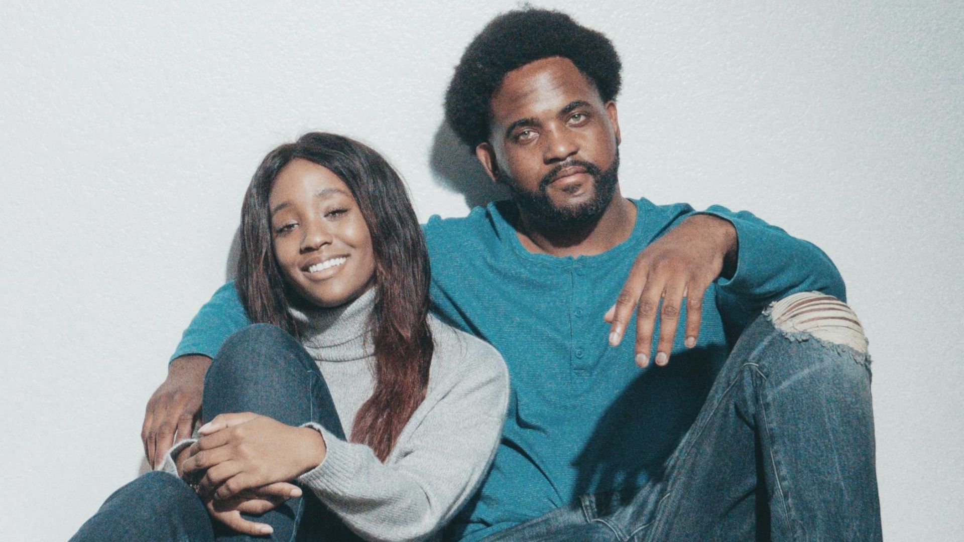 A joyful couple imagines their dream home with creative interior sketches.