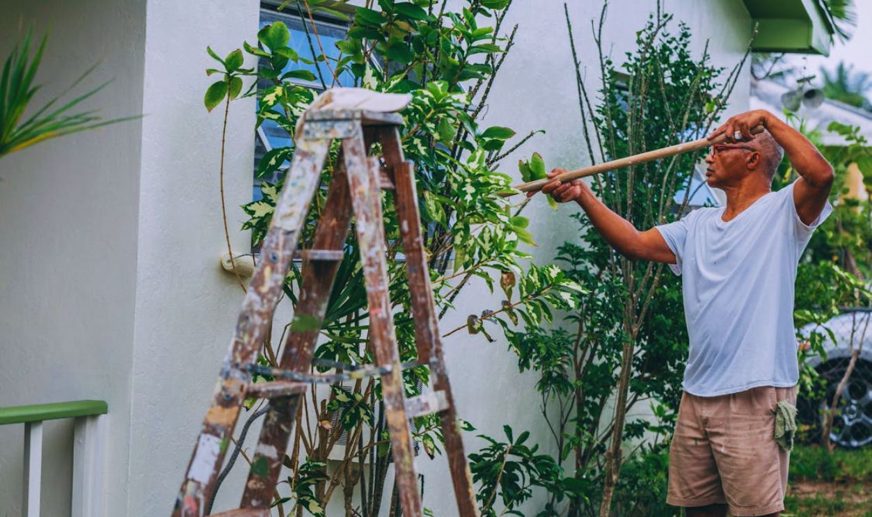 Man Painting a House