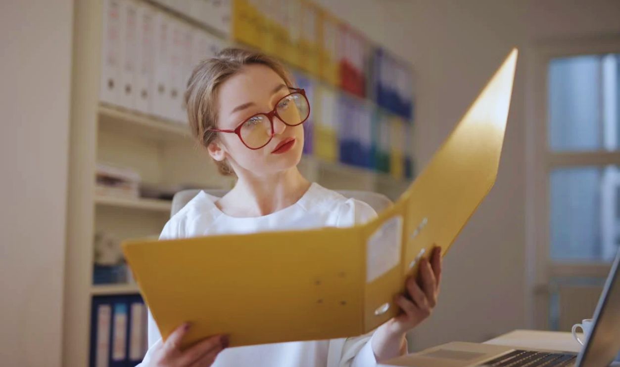 Female Accountant Looking at Documents
