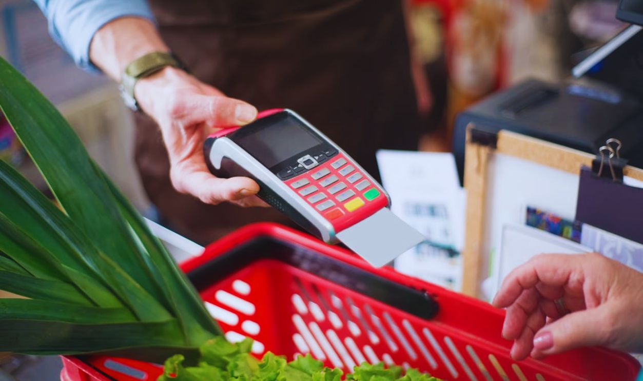 A Person Holding a Payment Terminal