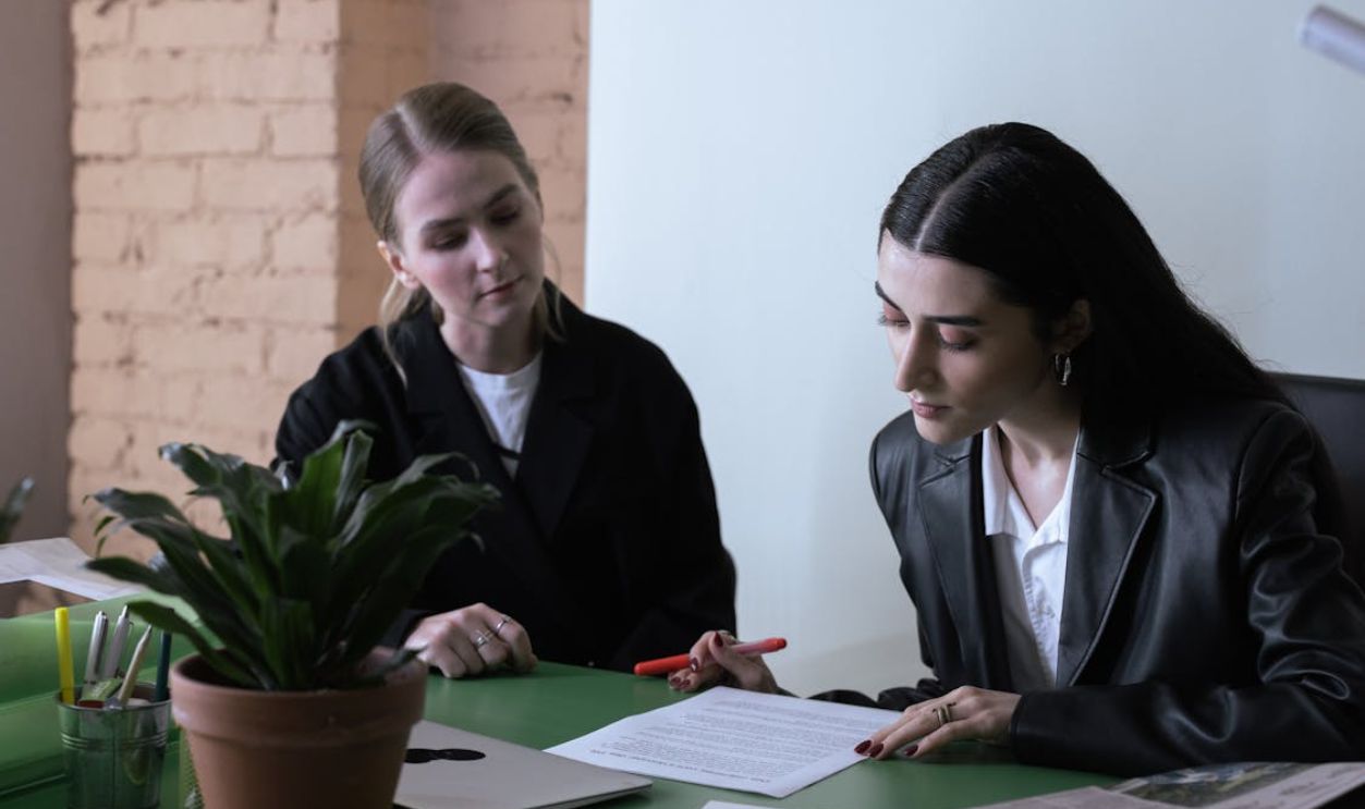Women Looking at the Document on the Table