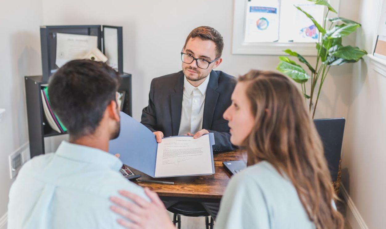 A Man Talking to a Couple