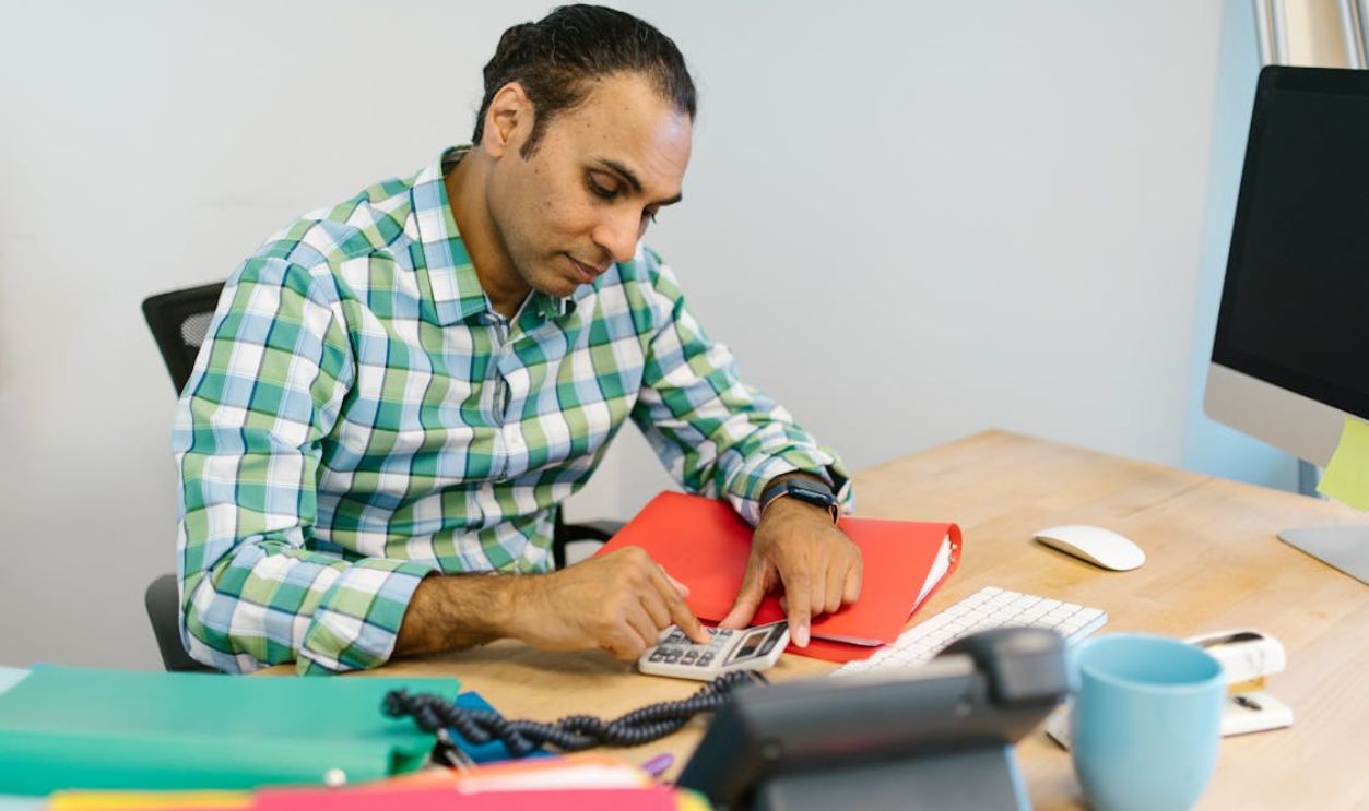Man Using a Calculator