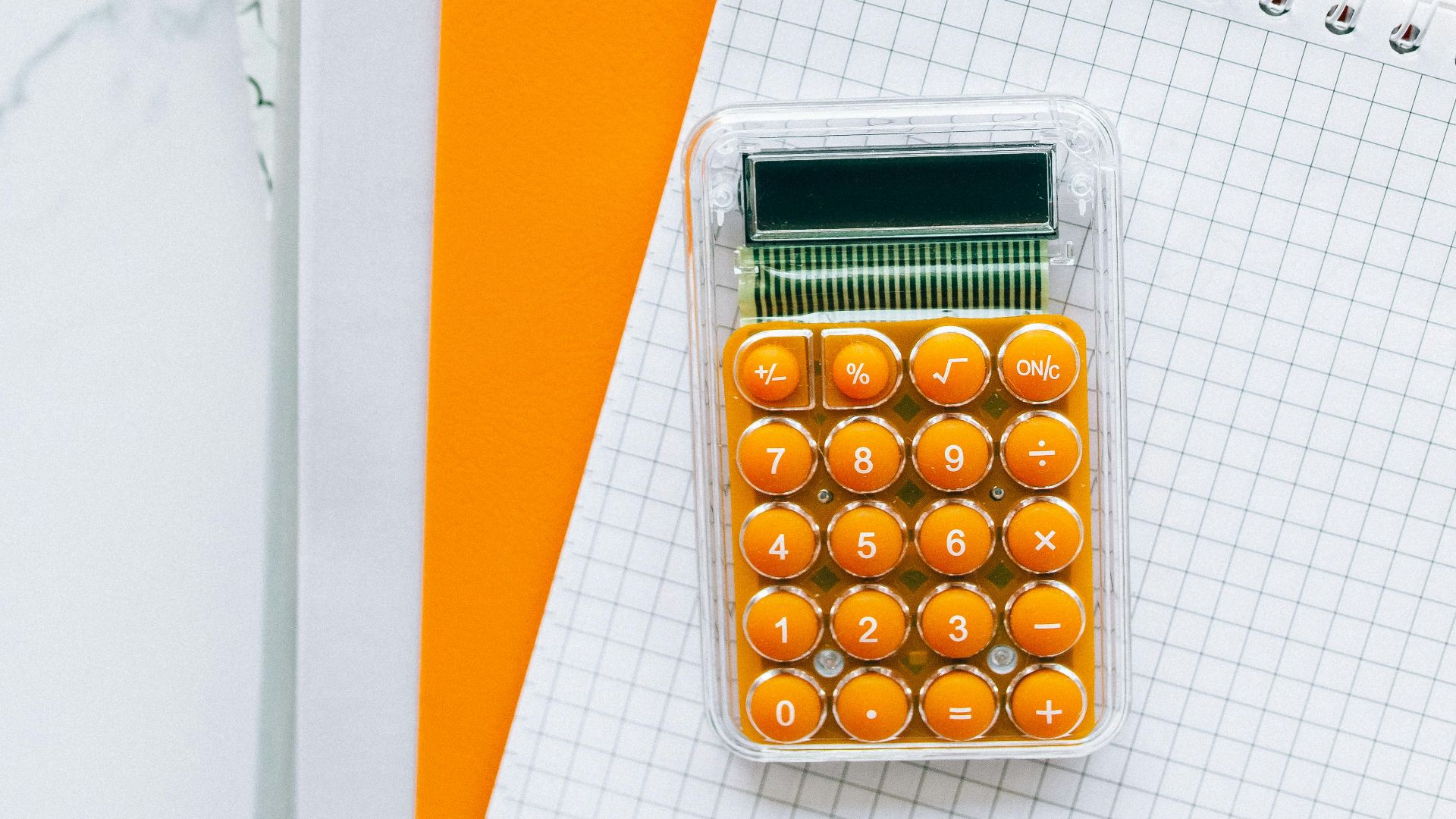 Bright stationery setup featuring a calculator and documents for efficient bookkeeping.