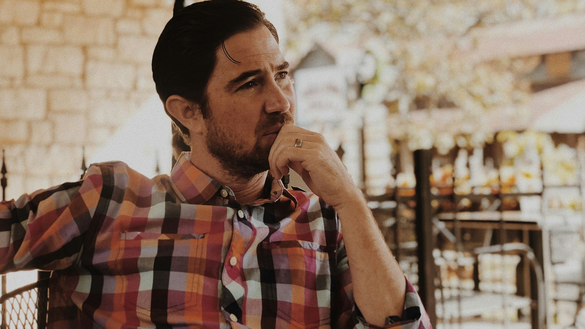 man in red and black plaid dress shirt