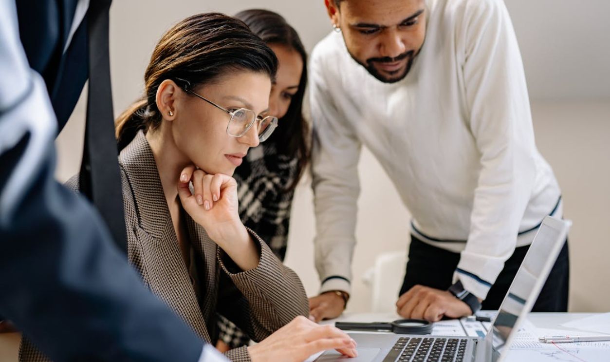 Women and Man Working over Laptop