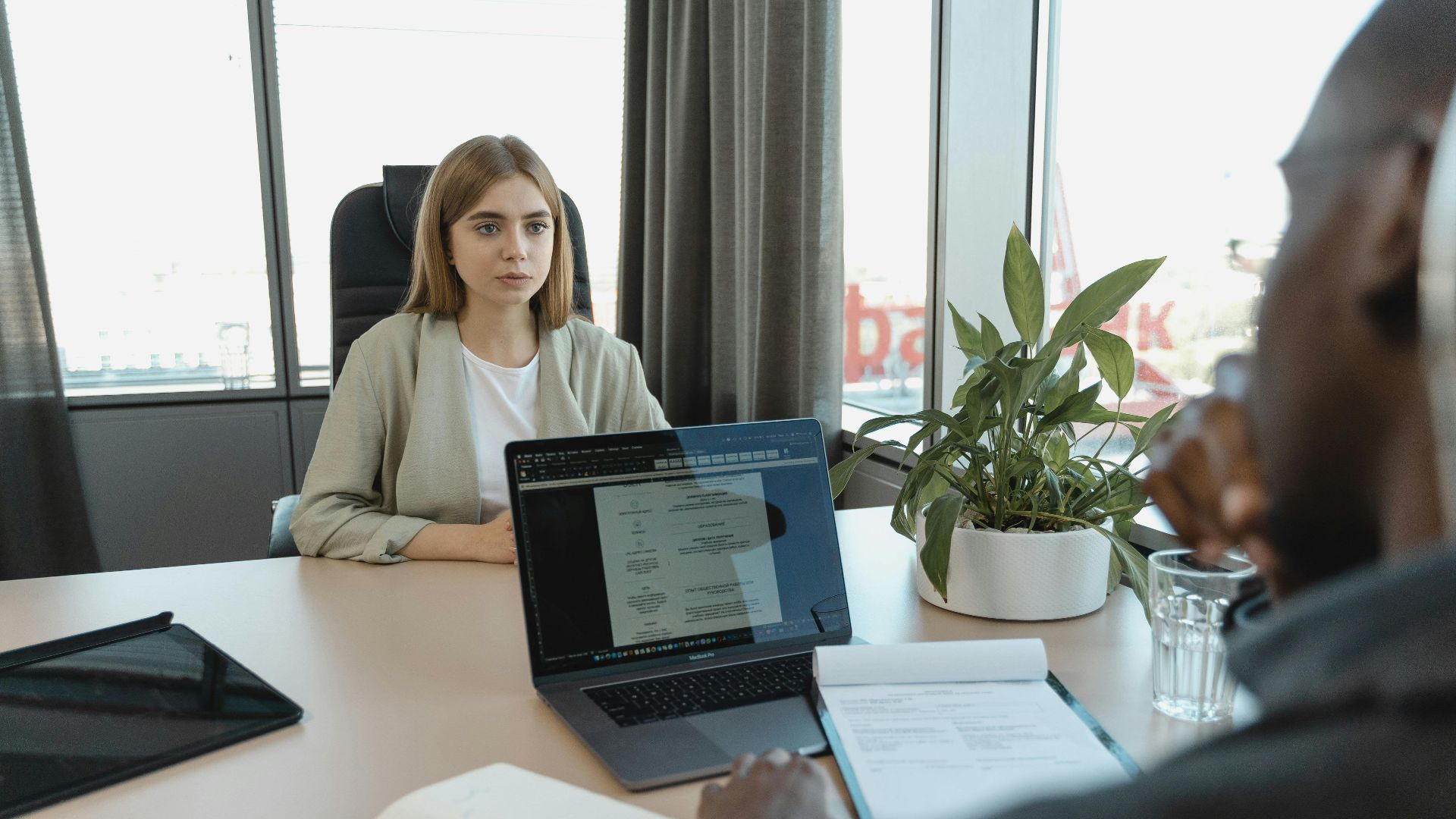 A professional job interview scene in a modern office setting, emphasizing recruitment and career opportunities.