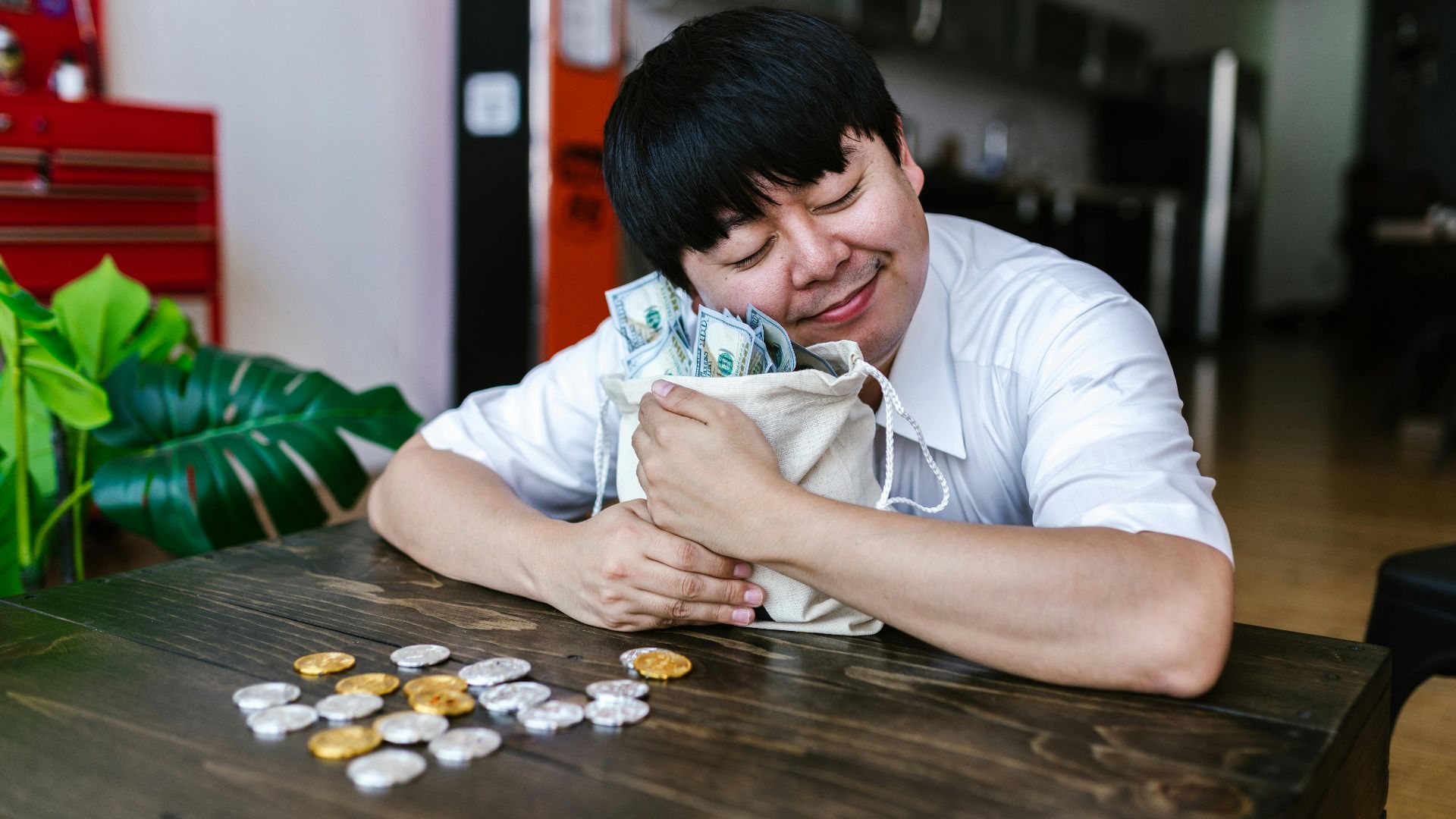 A happy trader hugging a bag of cash and cryptocurrency coins, symbolizing investment success.