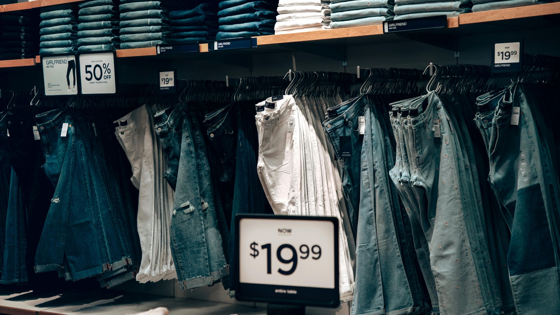 Explore a stylish denim collection at a boutique in Miami, showcasing jeans with discounts.