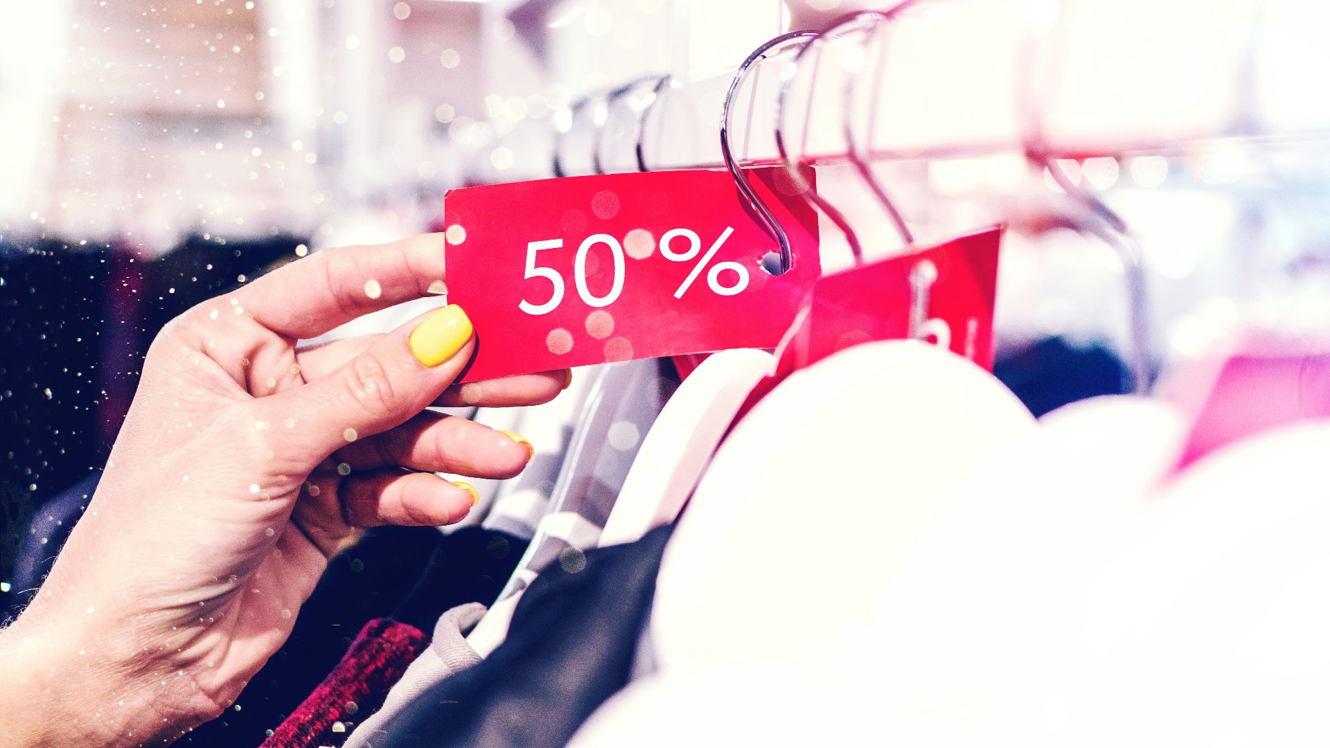 person holding red and white love print gift wrapper