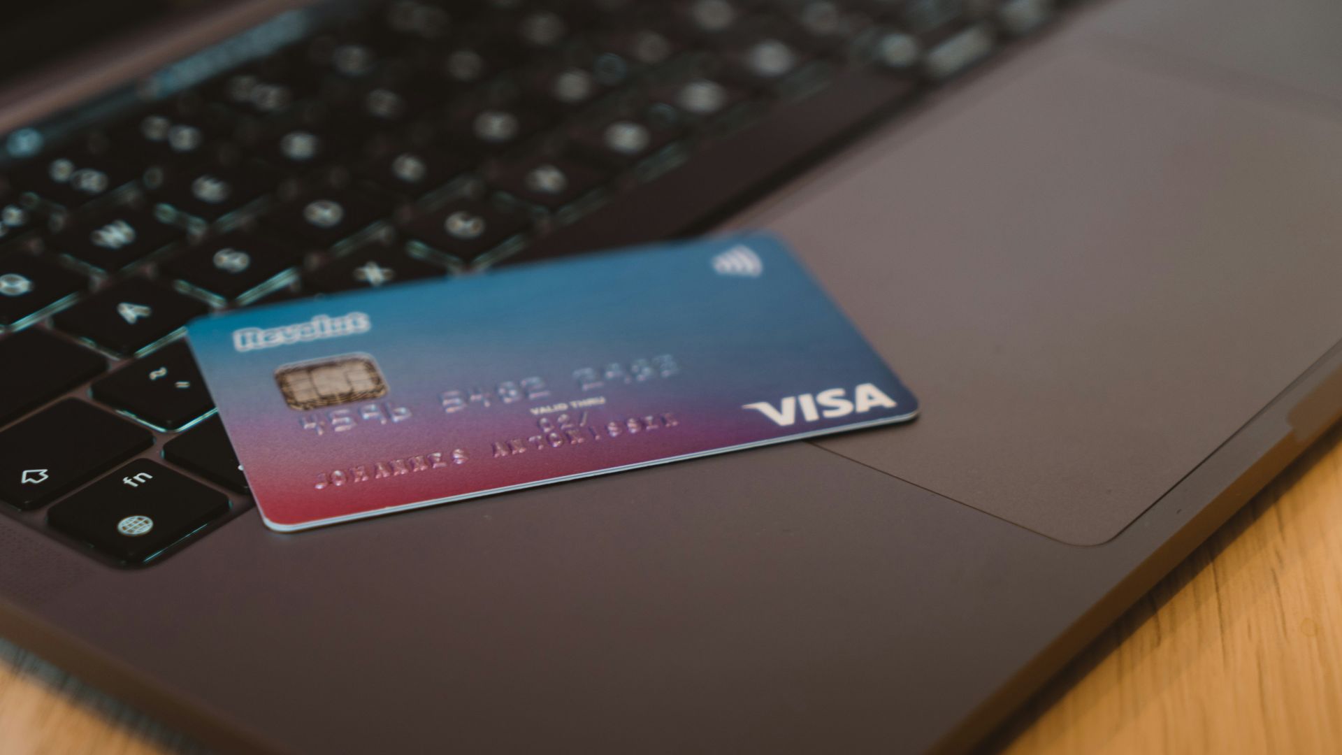 blue and white visa card on silver laptop computer