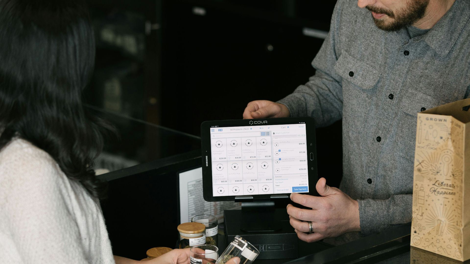a man and a woman standing in front of a counter