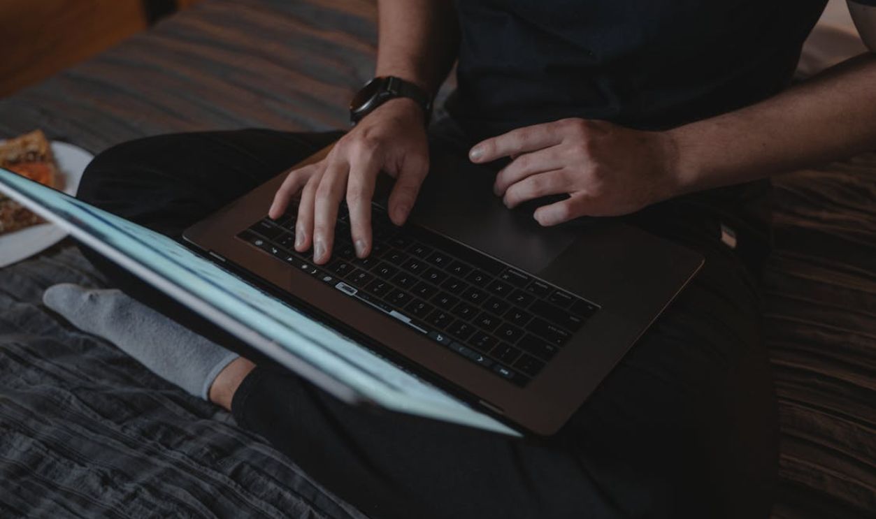 Sitting Cross-legged Person, Hold Laptop on its Lap