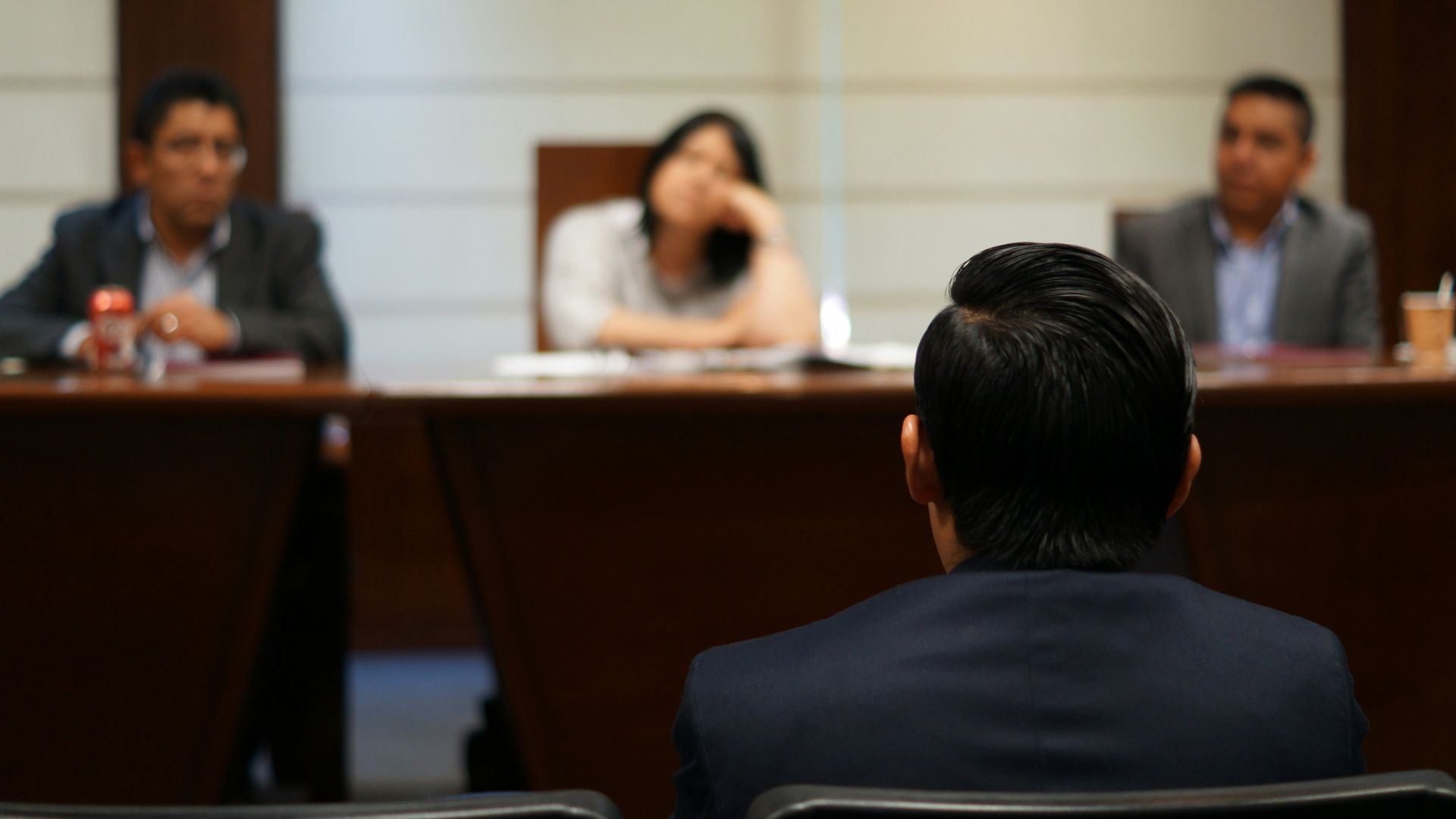 man in black shirt sitting beside woman in white shirt