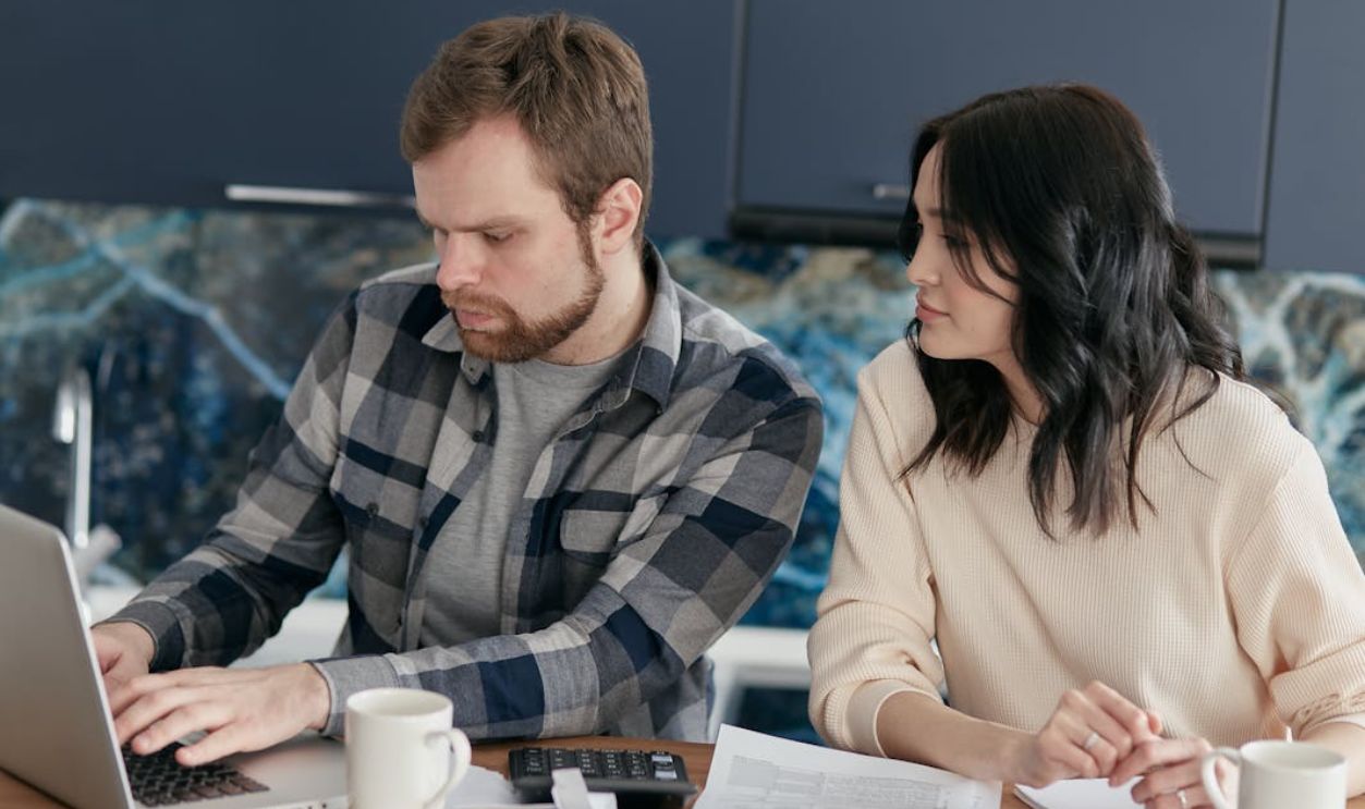 A Couple Looking at the Laptop Together