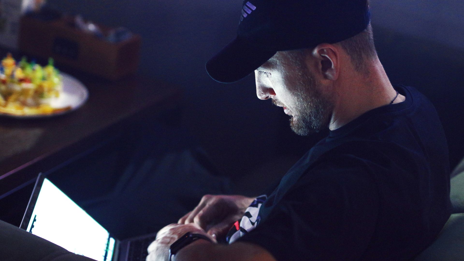 a man sitting in front of a computer