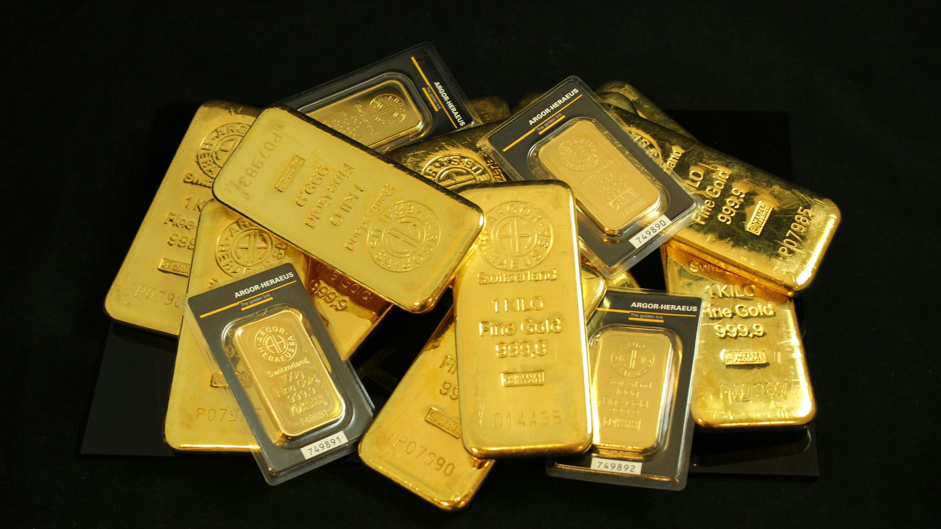 A collection of precious gold bars stacked elegantly, symbolizing wealth and prosperity.