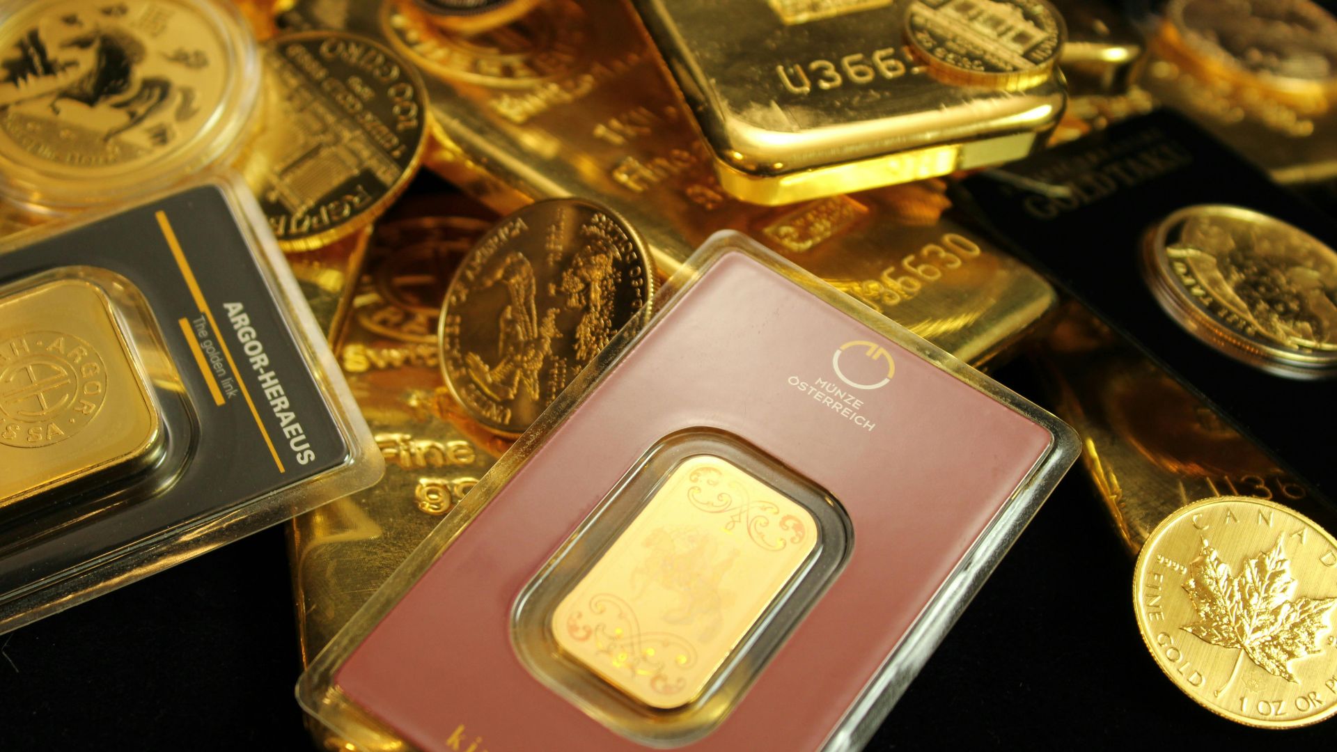 Detailed close-up of gold bars and coins symbolizing wealth and investment opportunities.