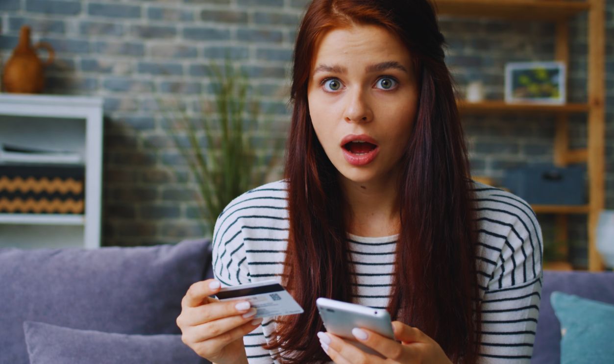 Shocked Woman With Credit Card