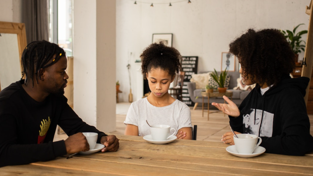 Parents talking to their daughter