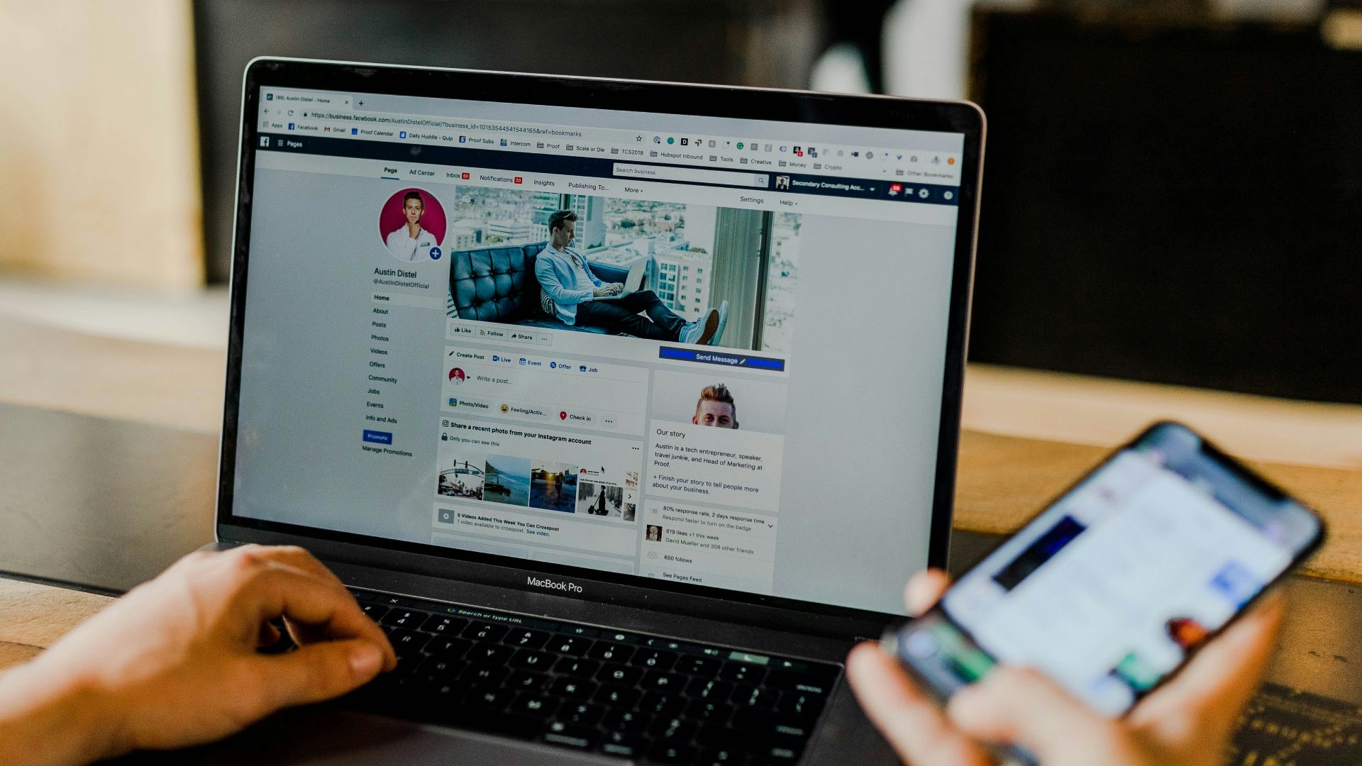 person using both laptop and smartphone