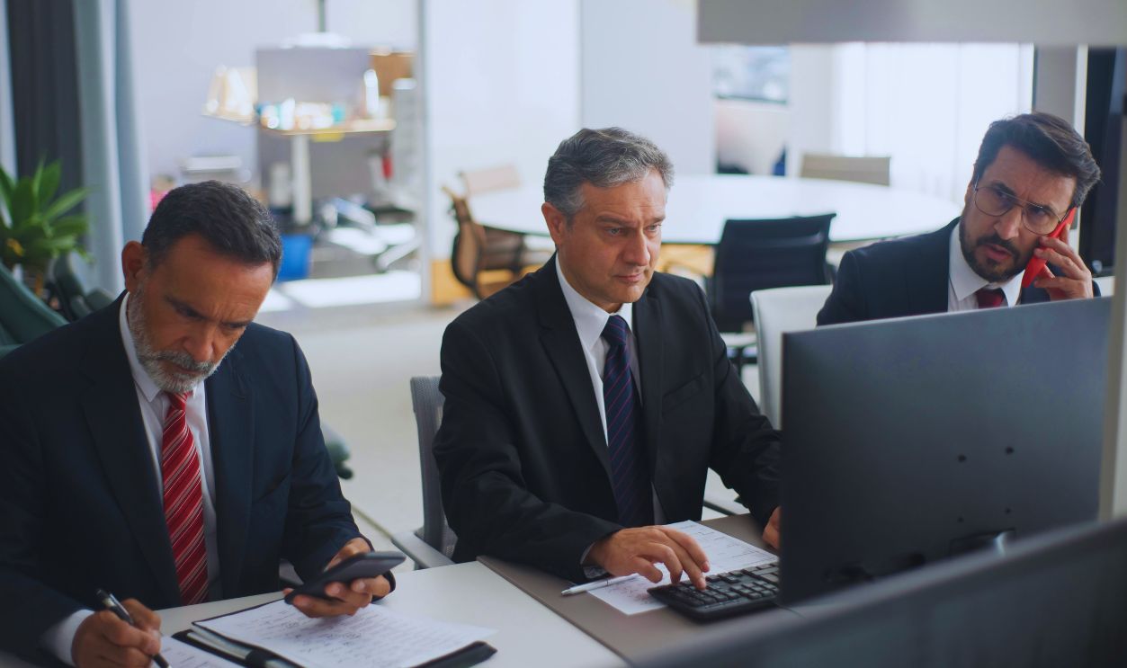 Men in Corporate Attire Working in an Office
