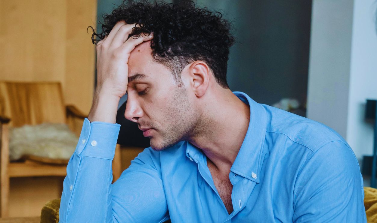 Emotional Man Holding His Head