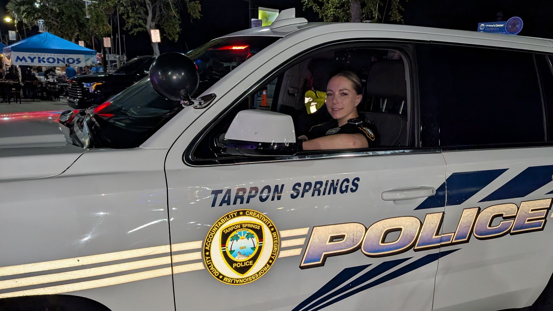 Female Police Officer in SUV Patrol Vehicle