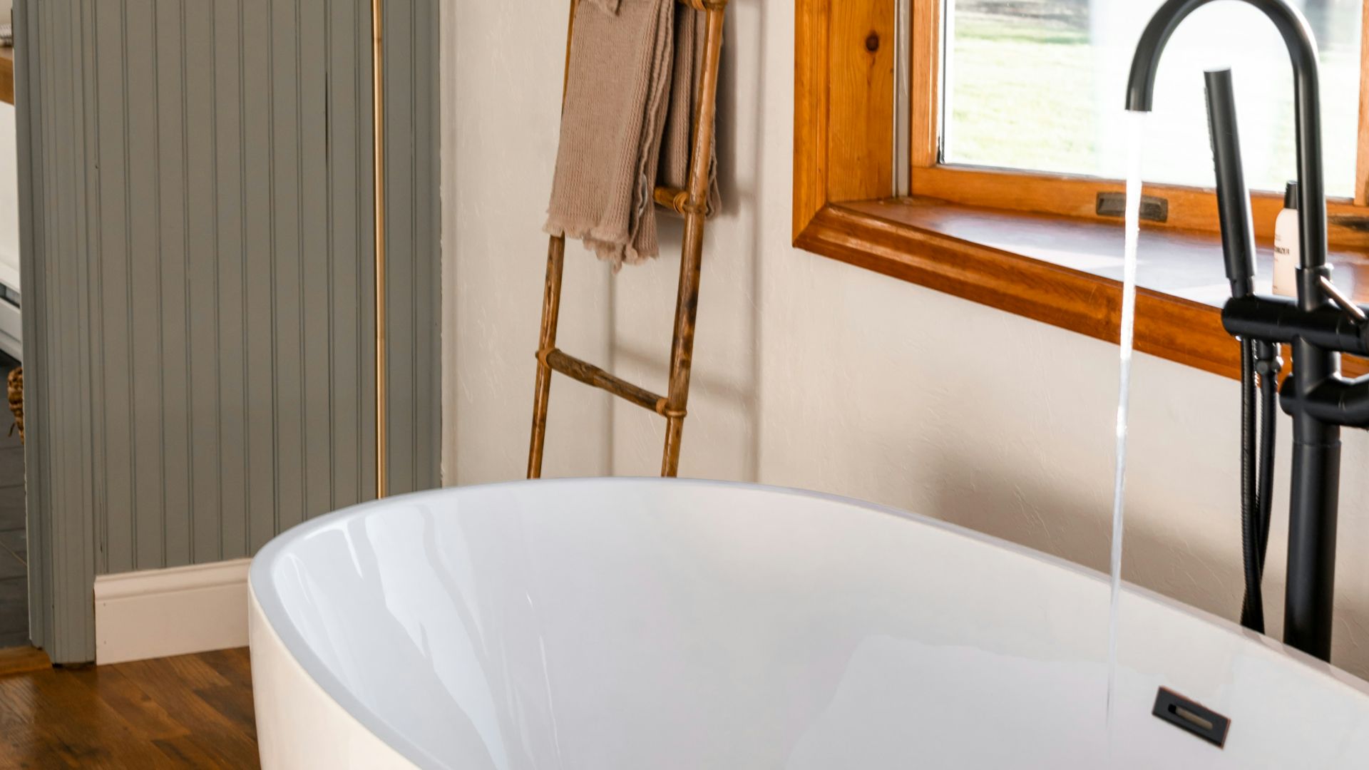 a large tub next to a sink