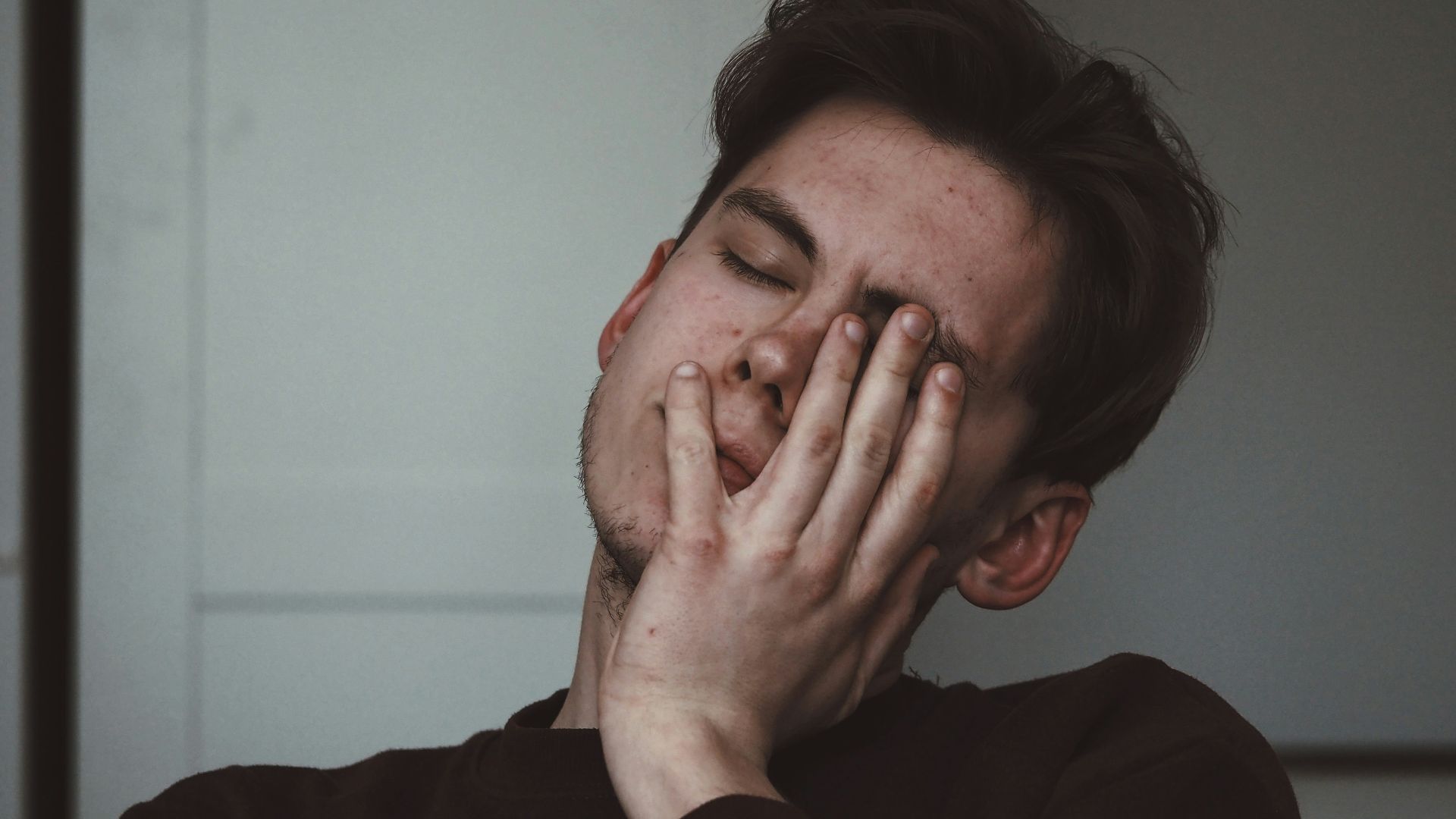 man wearing black crew-neck top