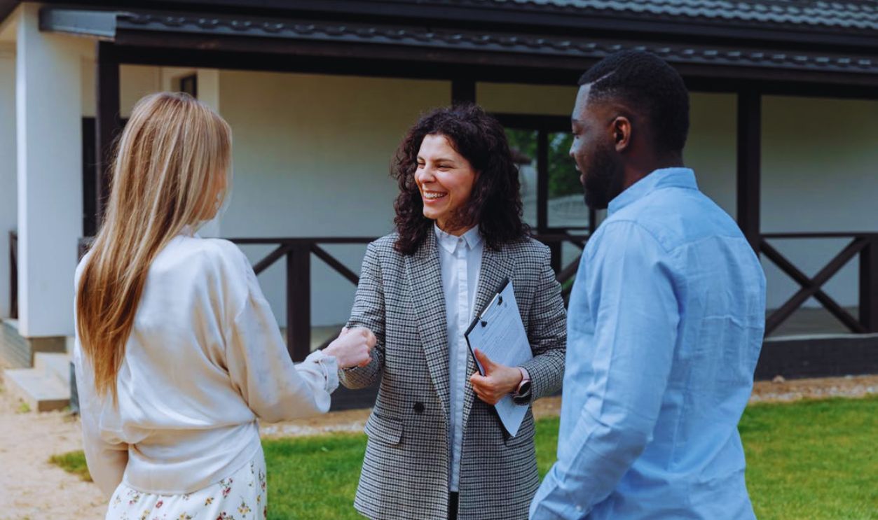 A Man Looking at the Woman Shaking Each Others Hands