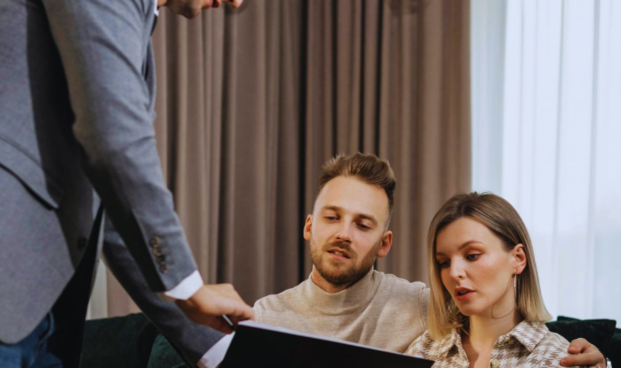 A Real Estate Agent Negotiating with a Couple