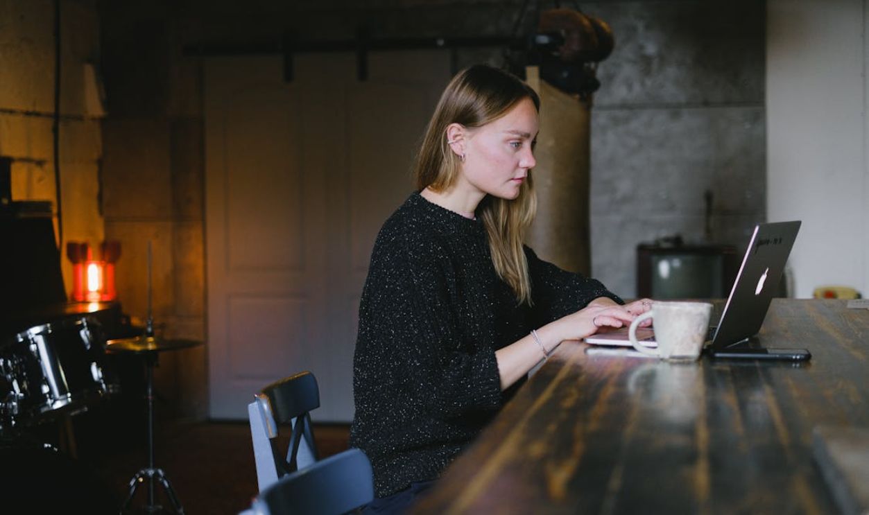 Young woman using laptop at home