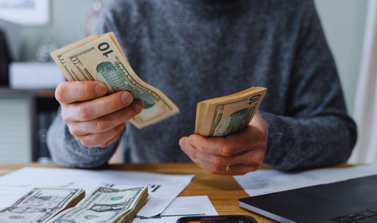 A Person Counting Money