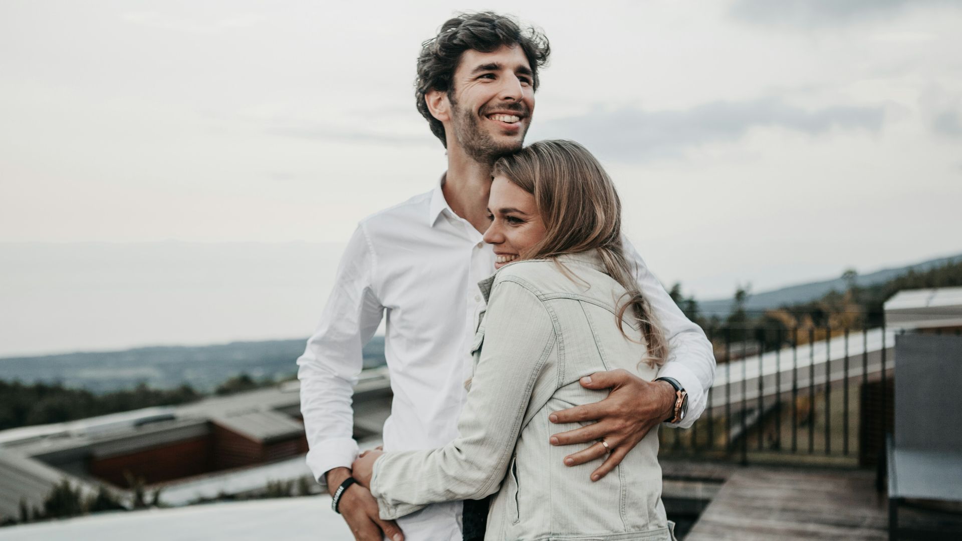 man and woman hugging each other