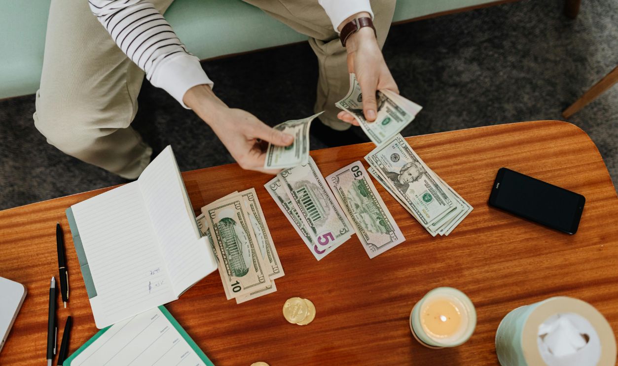 A Person Holding Bank Notes