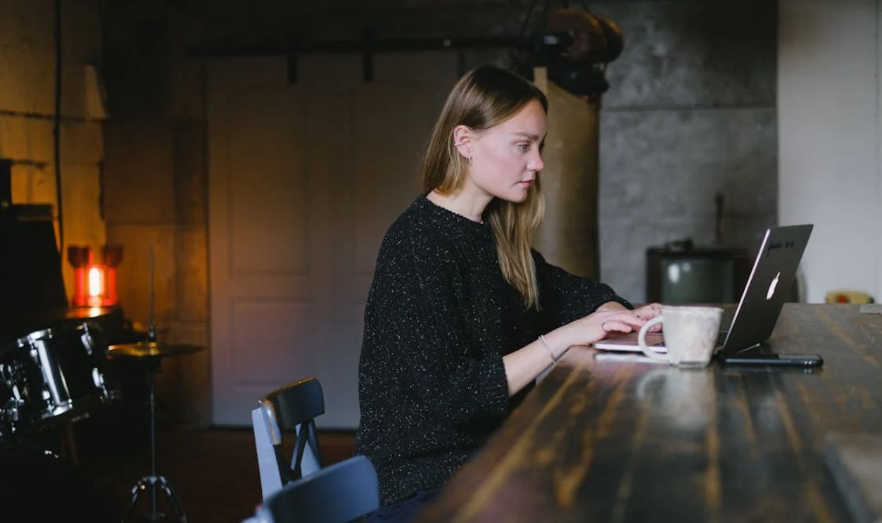 Young woman using laptop at home