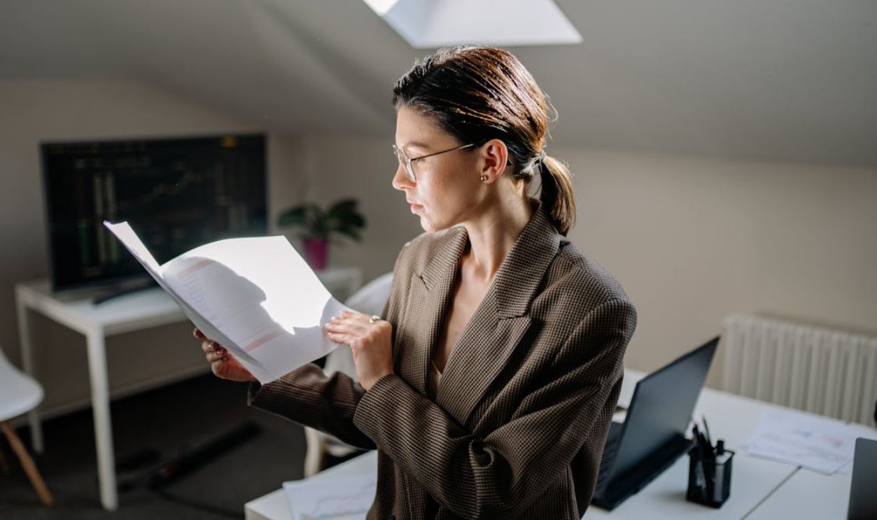 A Woman Looking the Papers