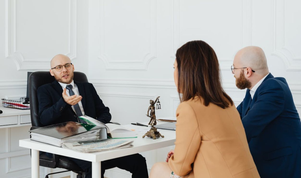 A Couple Talking to a Lawyer