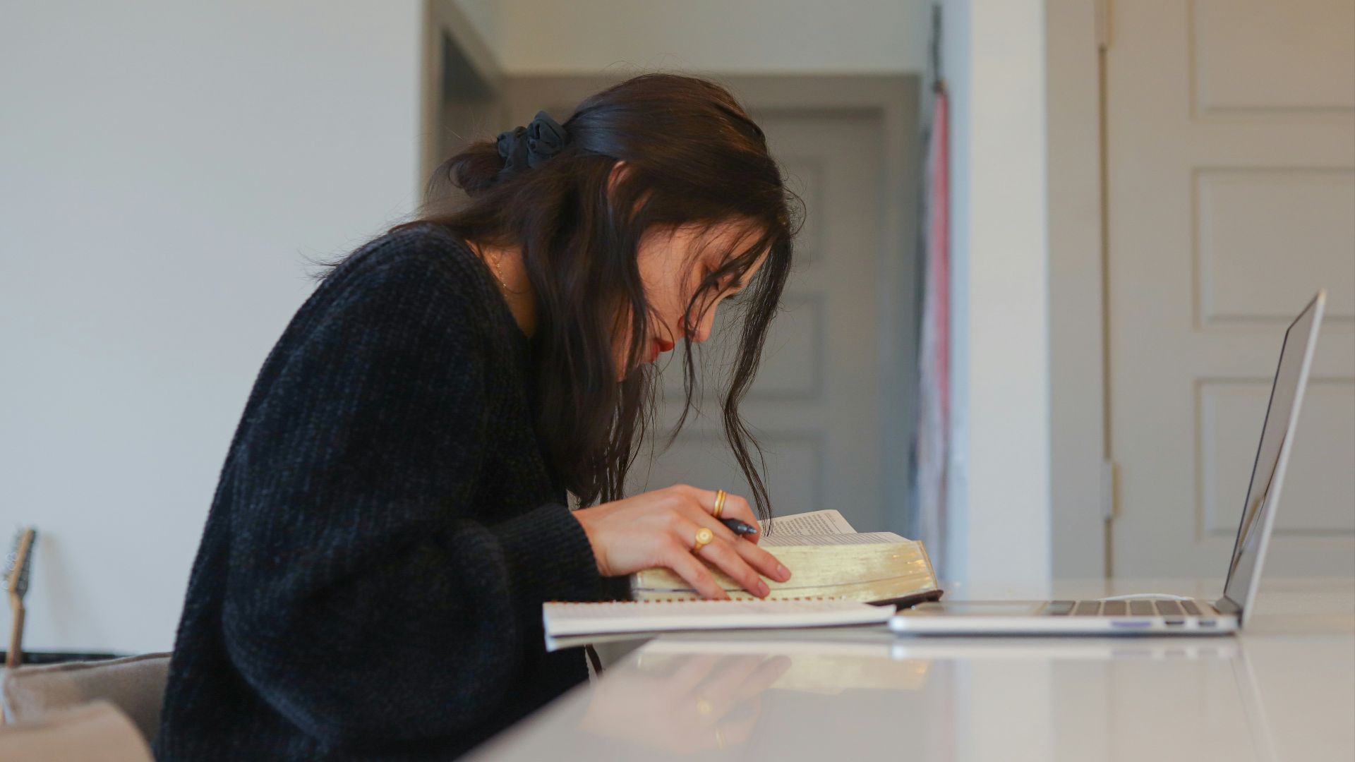 woman in black long sleeve shirt reading book