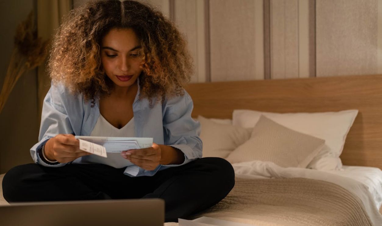 Photo of a Woman Reading a Letter