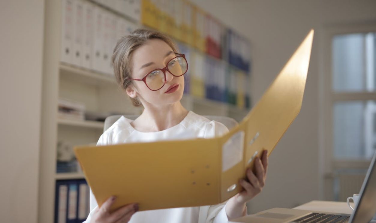Female Accountant Looking at Documents