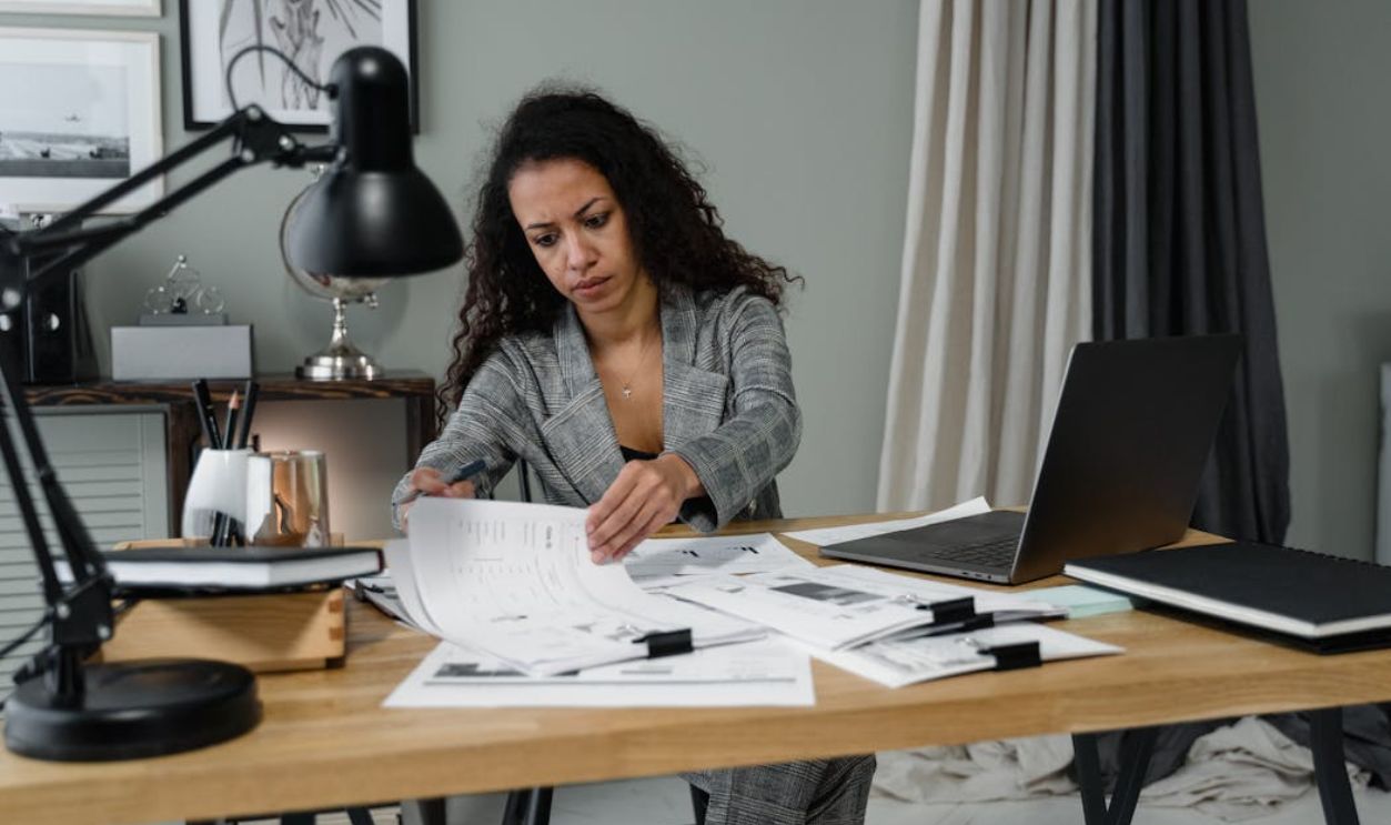 A Businesswoman Working with Papers in the Office