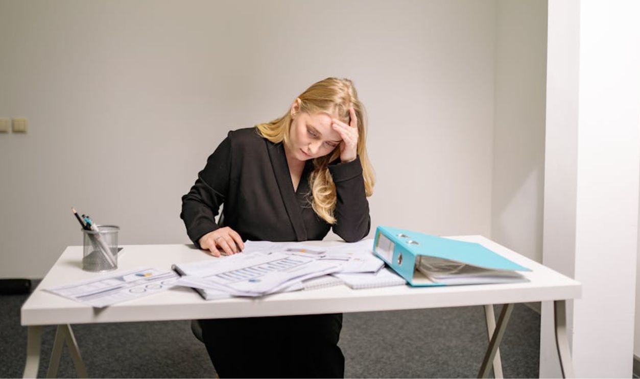Stressed Woman Sitting at the Table