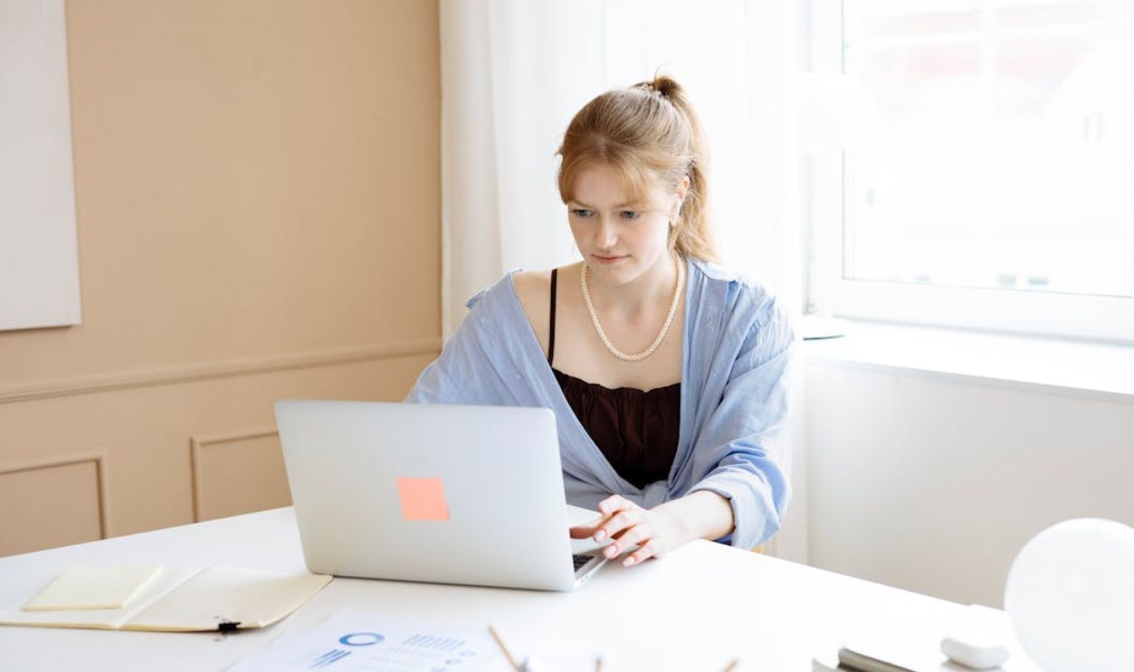 Woman Using a Laptop at the Office