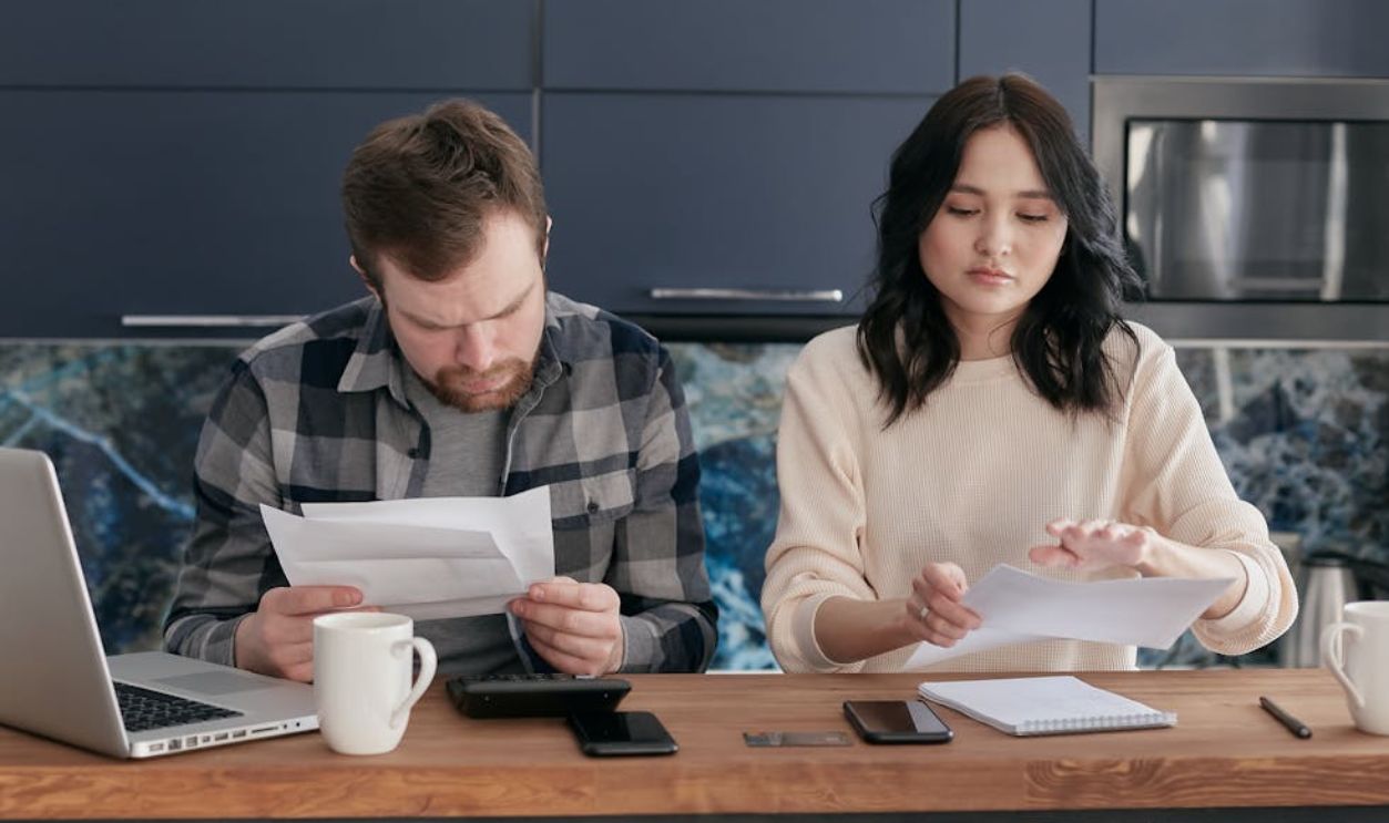 A Couple Looking at Documents