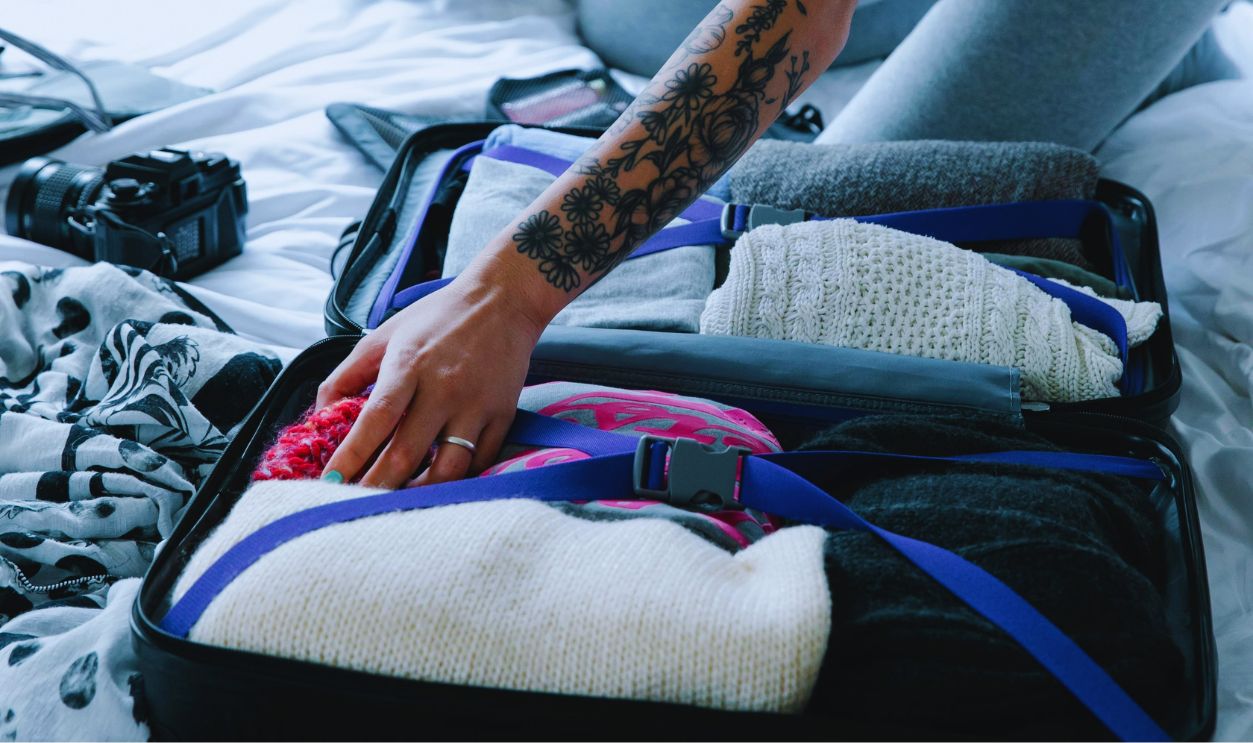 Woman in Gray Tank Top with Tattoo