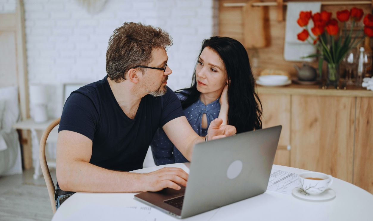 A Couple Using a Laptop