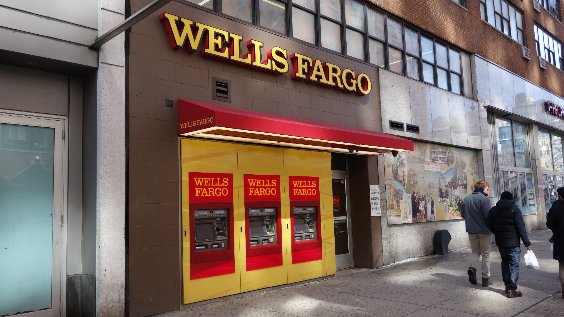 The Wells Fargo branch at ground level of the Mayfair apartments (145 Fourth Avenue), on the south side of 14th Street between Union Square East / 4th Avenue and Irving Place (Lexington Avenue) in the East Village / Union Square, Manhattan. This shop space was previously occupied by a pizzeria, an unusual transition.